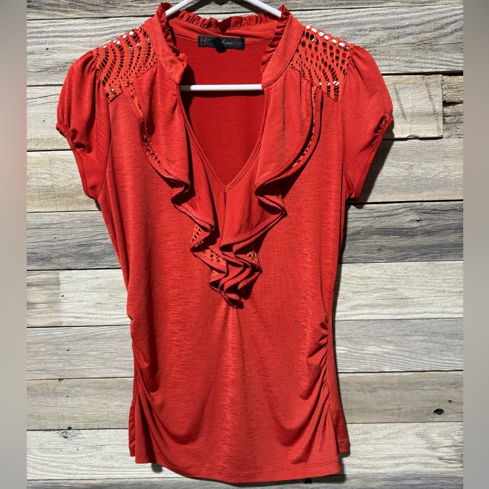 Heart Soul Orange  colored blouse.